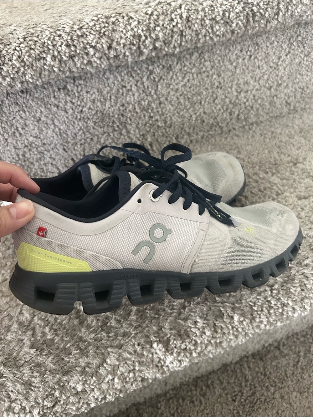 On Running Shoes in Light Gray with Black and Yellow Accents